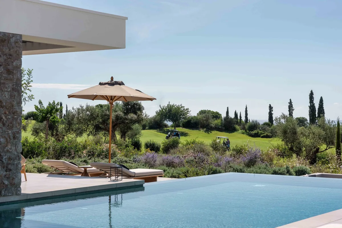 Pool water with garden and sea views beyond
